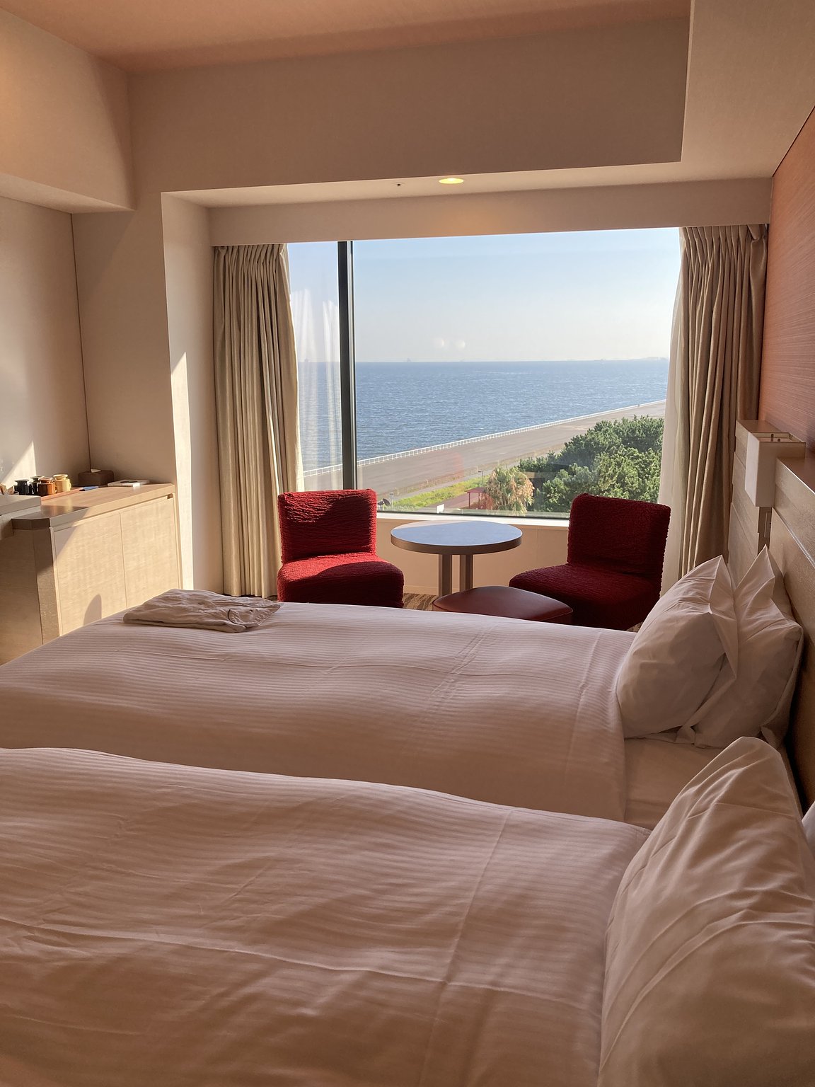 A spacious room with a view of the sea for a leisurely vacation feel